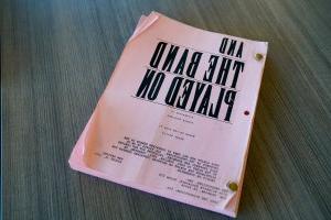 Photo of a film script that reads "And the Band Played On." 