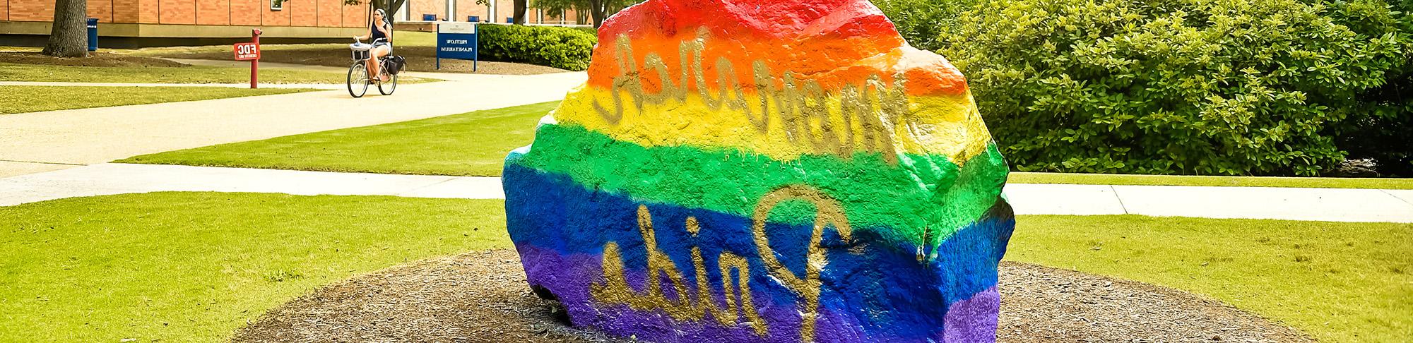 Monarch Pride painted on rock